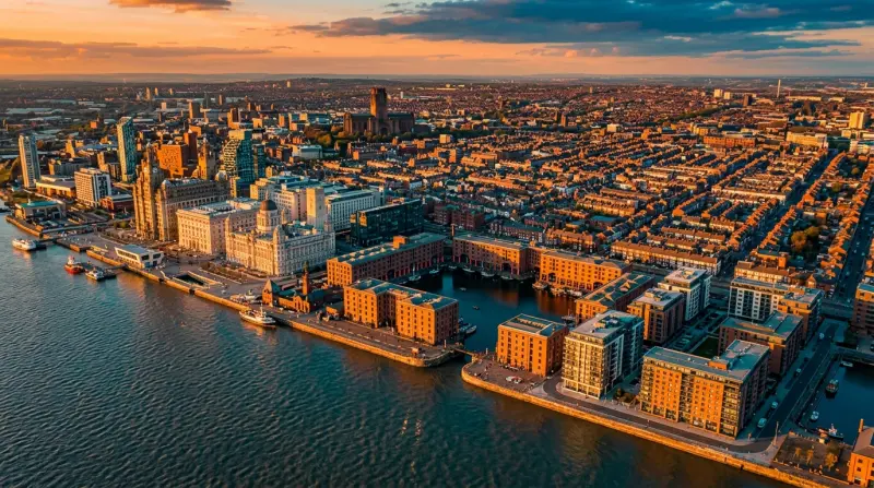 Aerial view of Liverpool city centre showing the waterfront, docks and dense terraced housing stretching inland