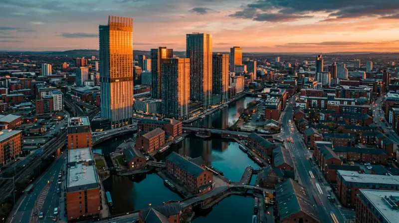 Modern apartment buildings along Salford Quays waterfront with media district offices in the background